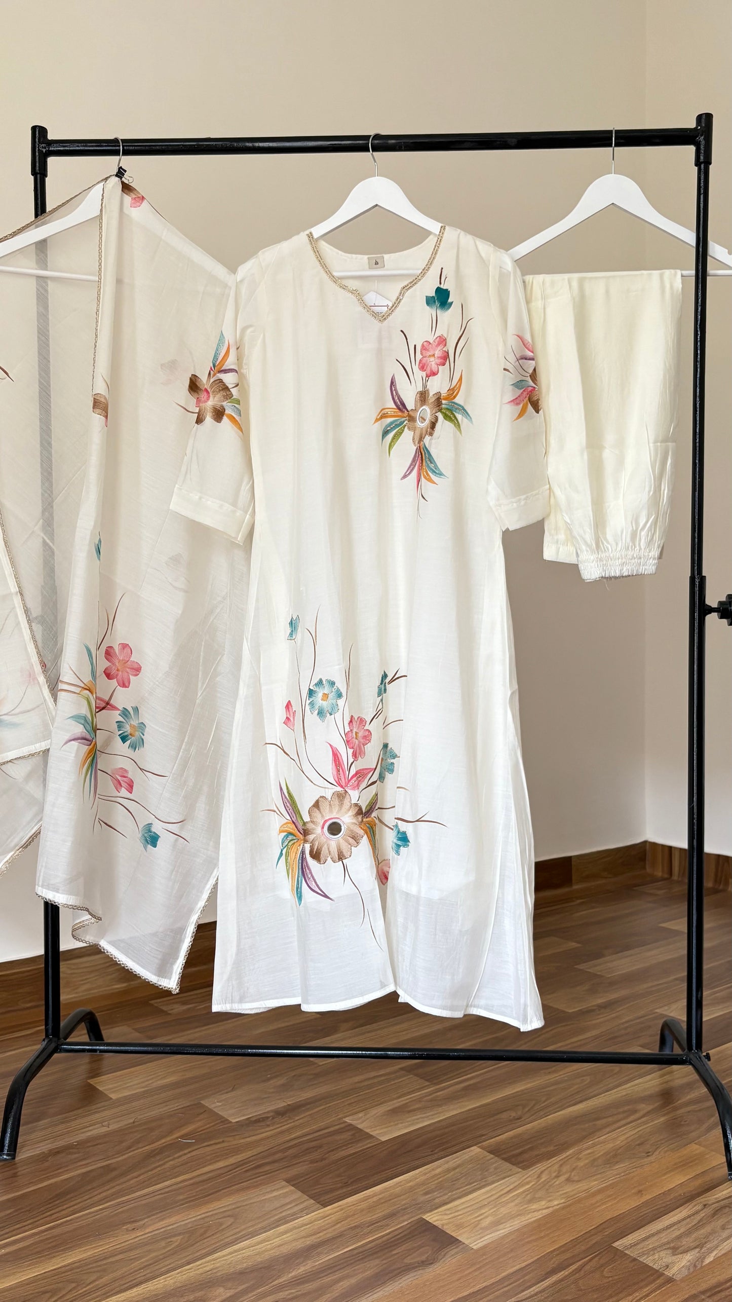 Luxurious off white silk A-line floral kurti set